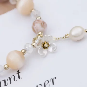 璨金琉璃橘晶粉殼花×固定式串珠手鍊.avif